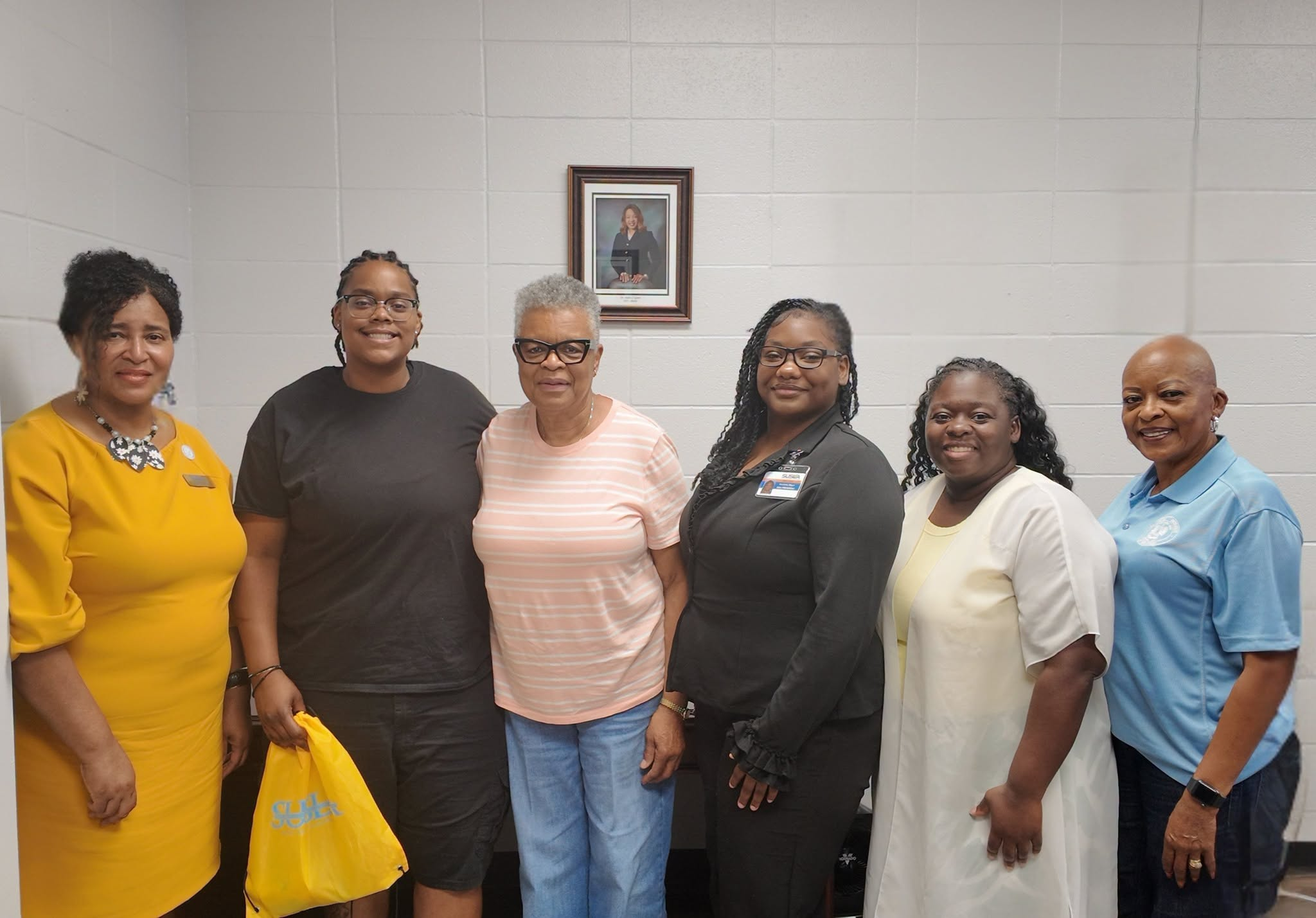 From left to right: Cheryl Taylor, Bailey Bishop, Alice Bishop, Marlisha Black, Tralicia Allen, and Jean Mosley smile for group photo.