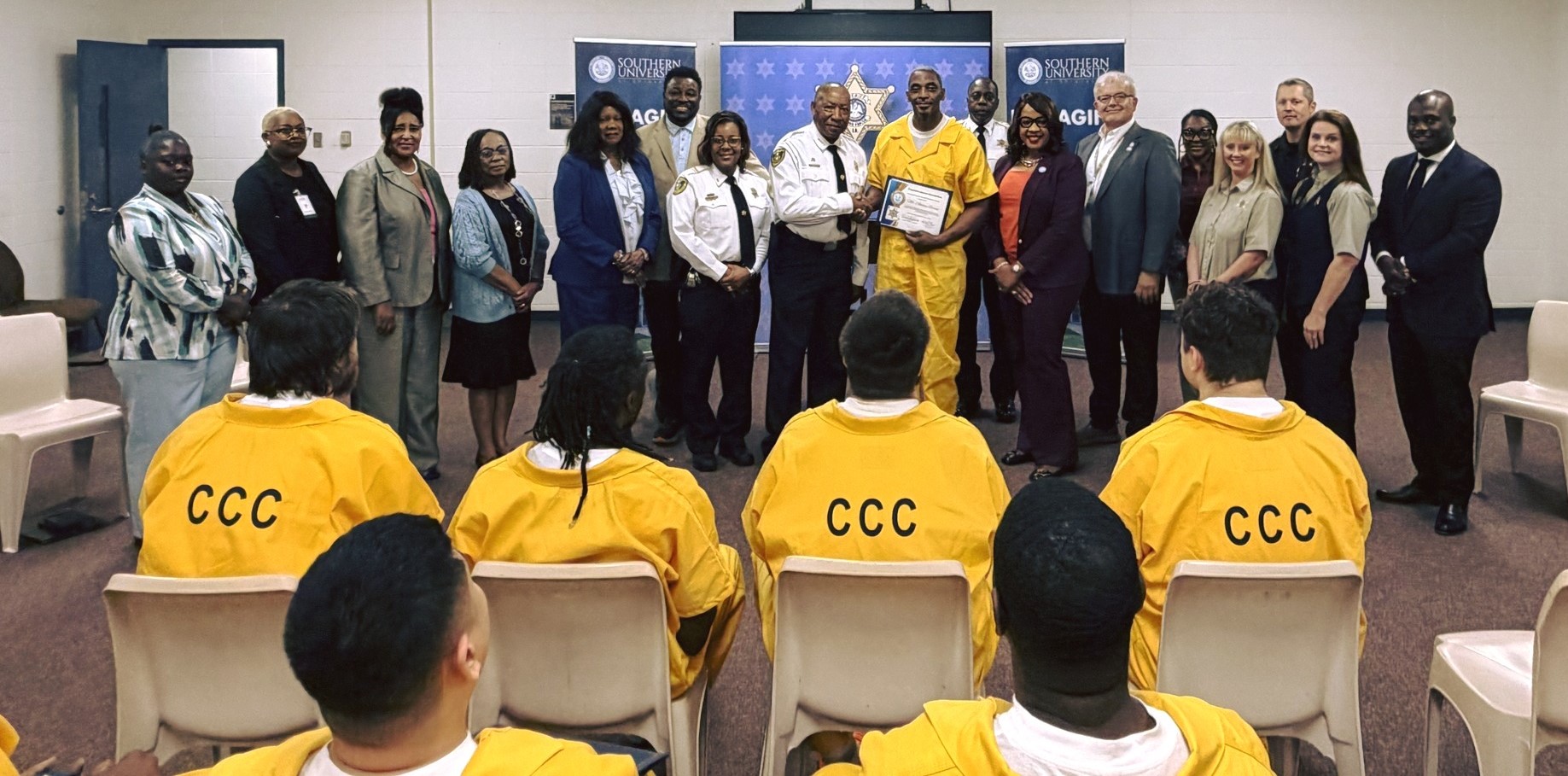 SUSLA family smiles for photographs with Caddo Parish Sheriff Office 
