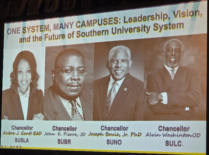 A presentation displayed on a screen. "ONE SYSTEM, MANY CAMPUSES: Leadership, Vision, and the Future of Southern University System." Portraits of SUS Chancellors.