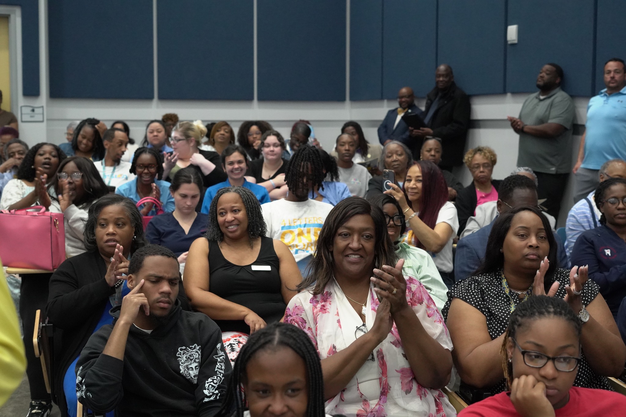 Members in the audience clapping