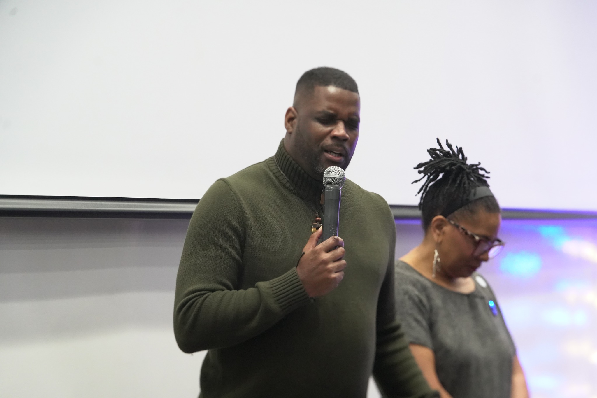 Guest speaker in prayer