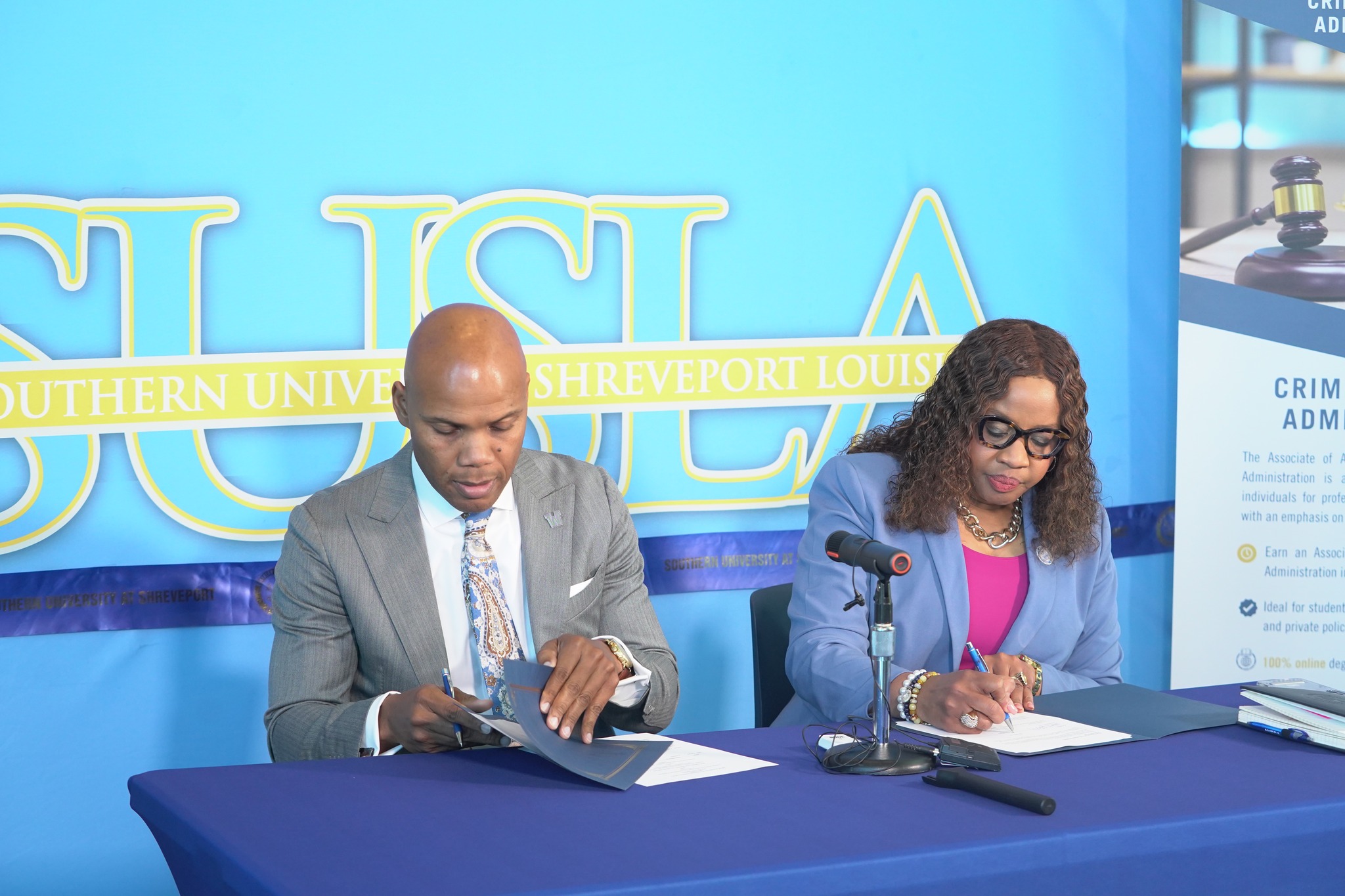 Dr. Gantt and Dr. Herman J. Felton Jr. sign documents for partnership